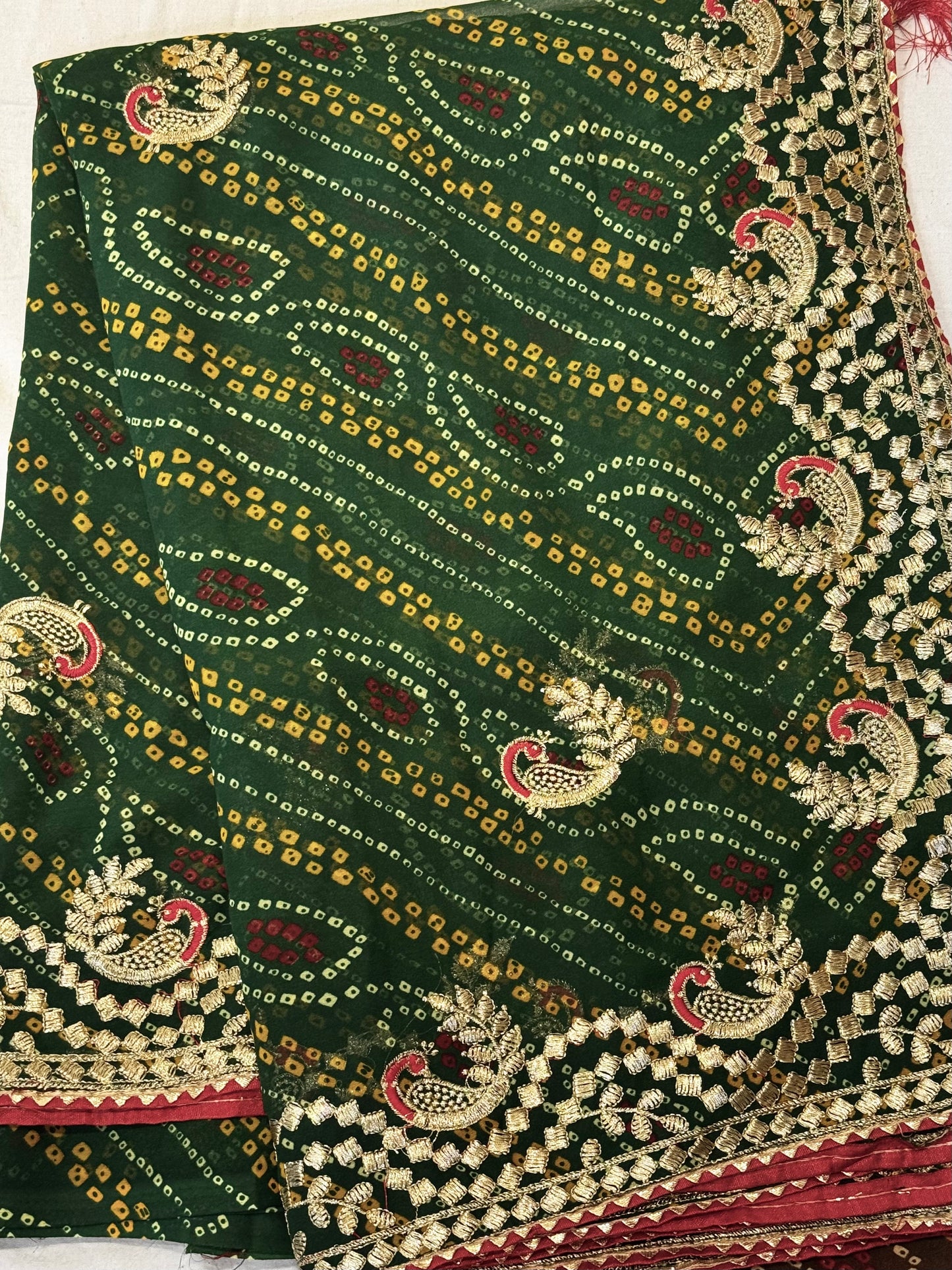 Kumkum – A Handcrafted Green Bandhani Saree with Gota Embroidery