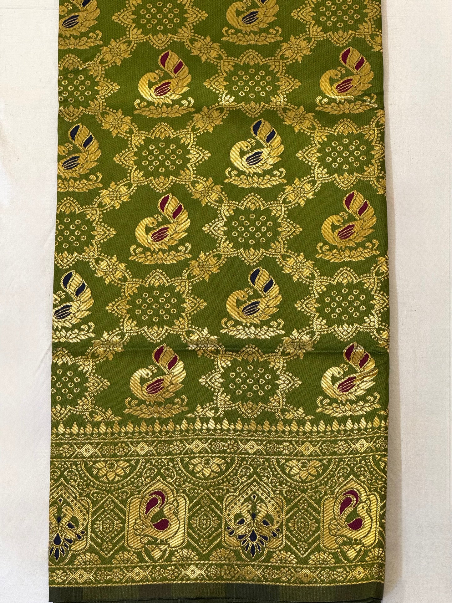 Vanya – A Handwoven Olive Green Patola Saree with Navy Contrast and Golden Zari Detailing