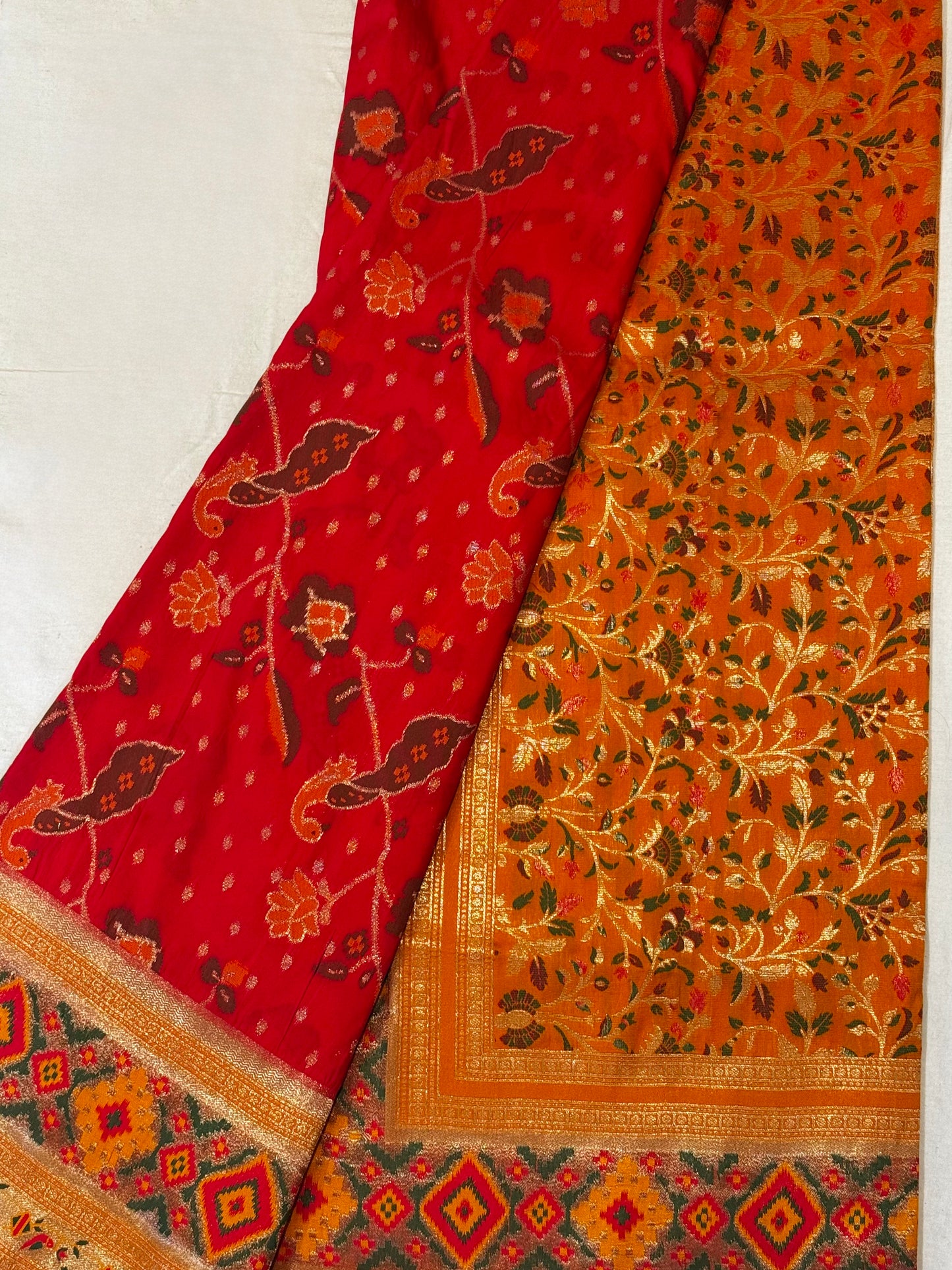 Surya – A Handwoven Pink Patola Saree with Orange Contrast and Golden Zari Detailing