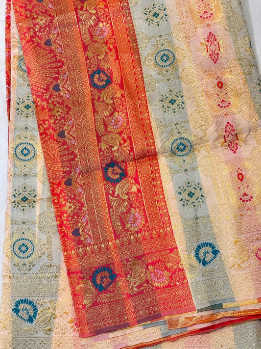 Aaradhya – A Handwoven Ivory Patola Saree with Scarlet Border and Intricate Golden Zari Work