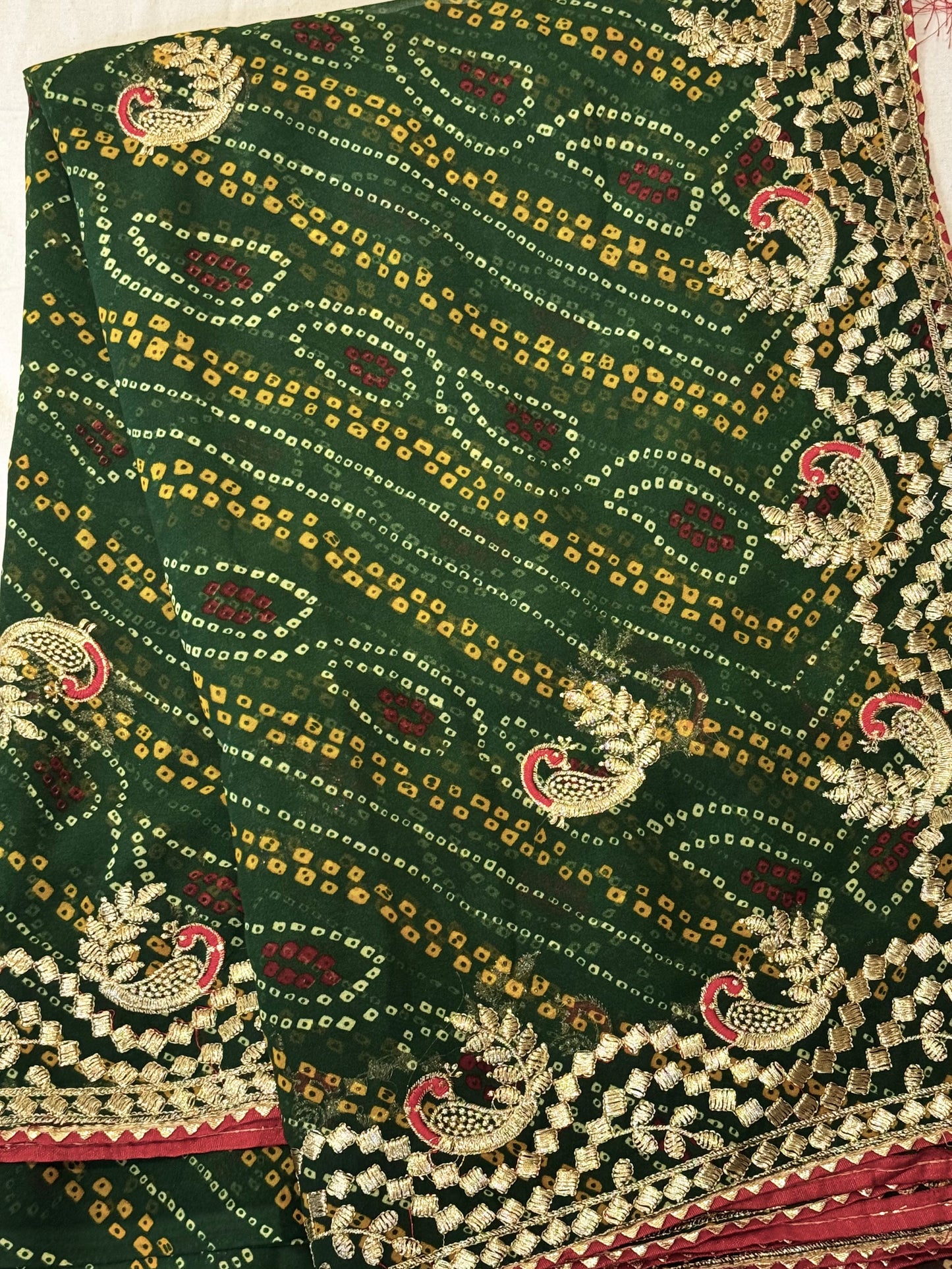 Kumkum – A Handcrafted Green Bandhani Saree with Gota Embroidery