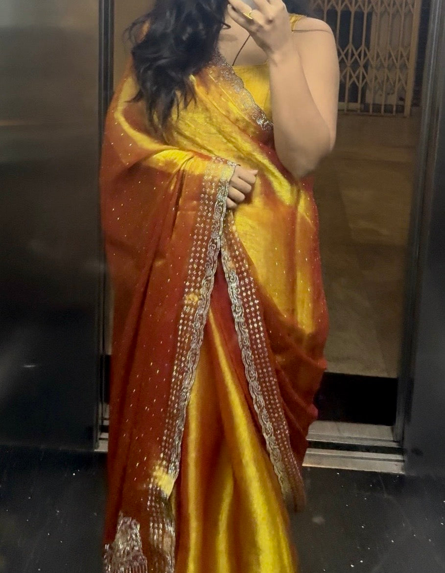 Aarika – A Sunset Gold Tissue Silk Saree with Embellished Border