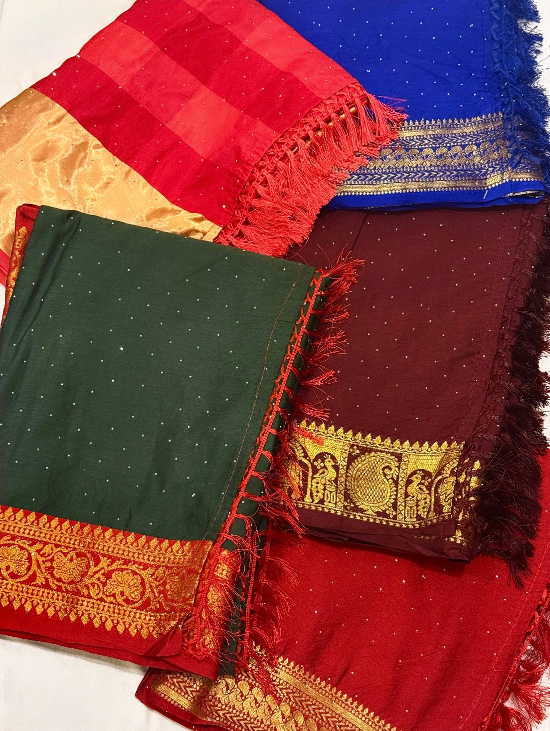 Rajlaxmi – Dola Silk Sarees with Zari Borders and Swarovski Detailing