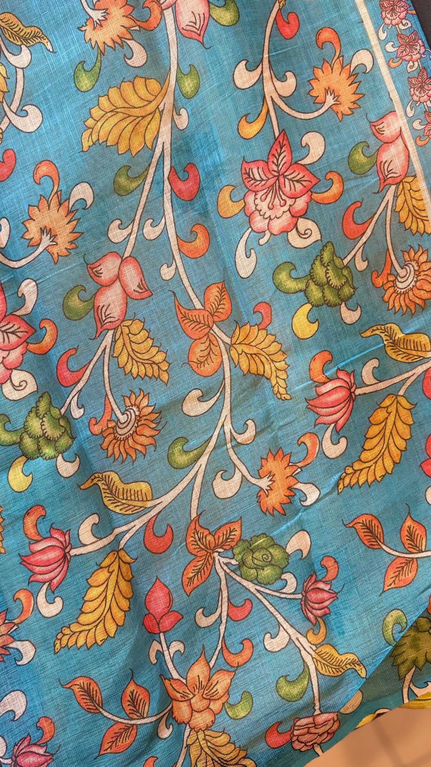 Sunayana – A Vibrant Yellow Saree with Blue Floral Border and Tassels