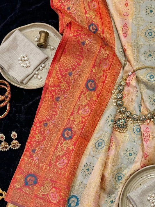 Aaradhya – A Handwoven Ivory Patola Saree with Scarlet Border and Intricate Golden Zari Work