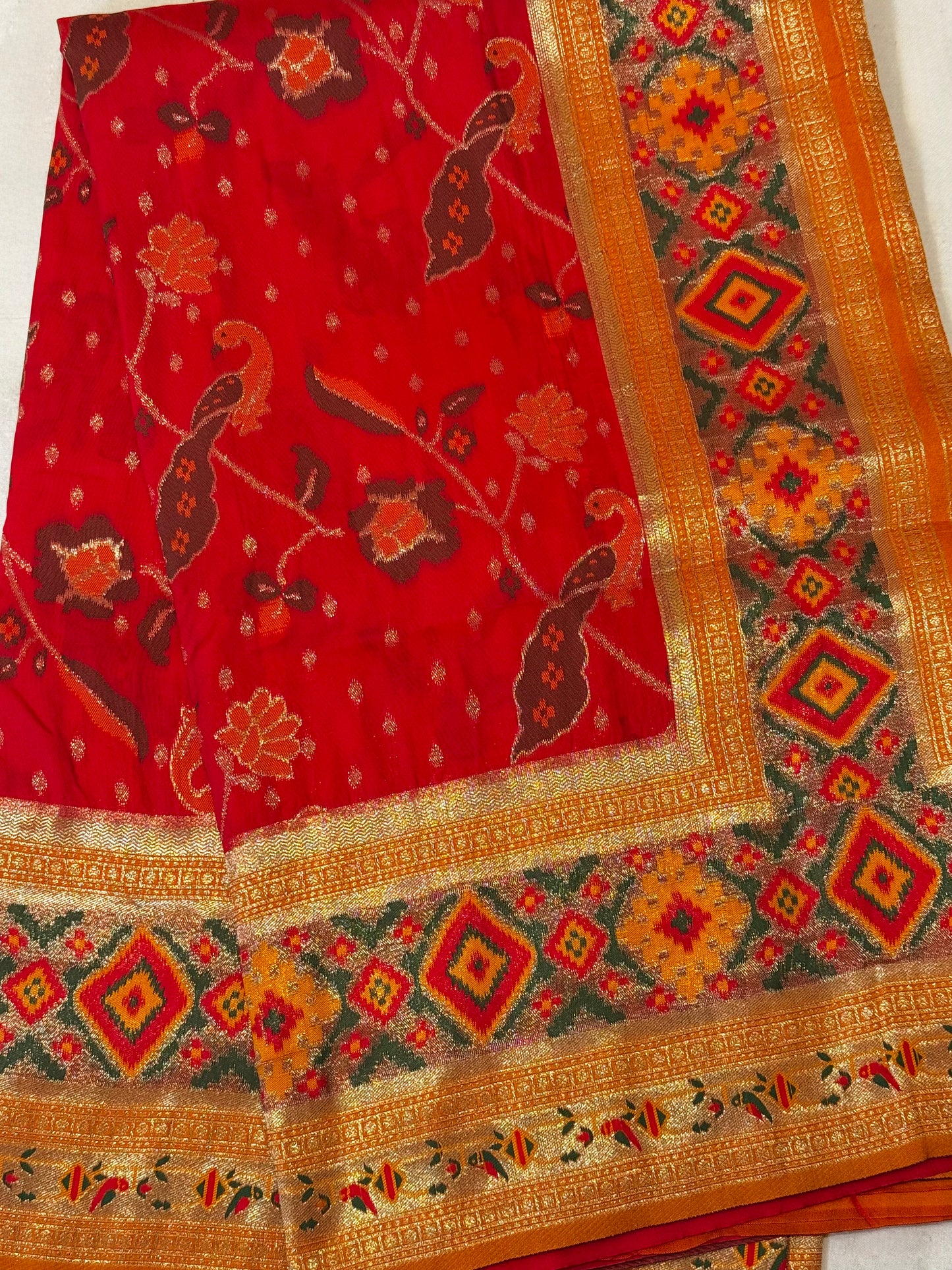 Surya – A Handwoven Pink Patola Saree with Orange Contrast and Golden Zari Detailing