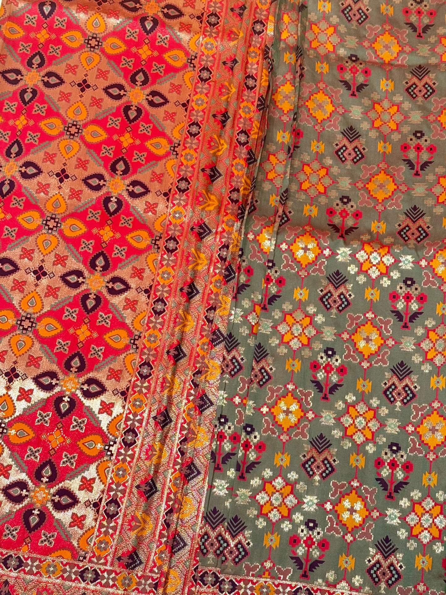 Tara – A Handwoven Green Patola Saree with Copper-Pink Border and Vibrant Ikat Motifs