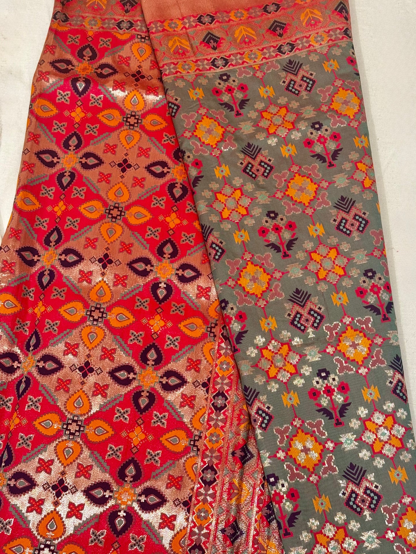 Tara – A Handwoven Green Patola Saree with Copper-Pink Border and Vibrant Ikat Motifs