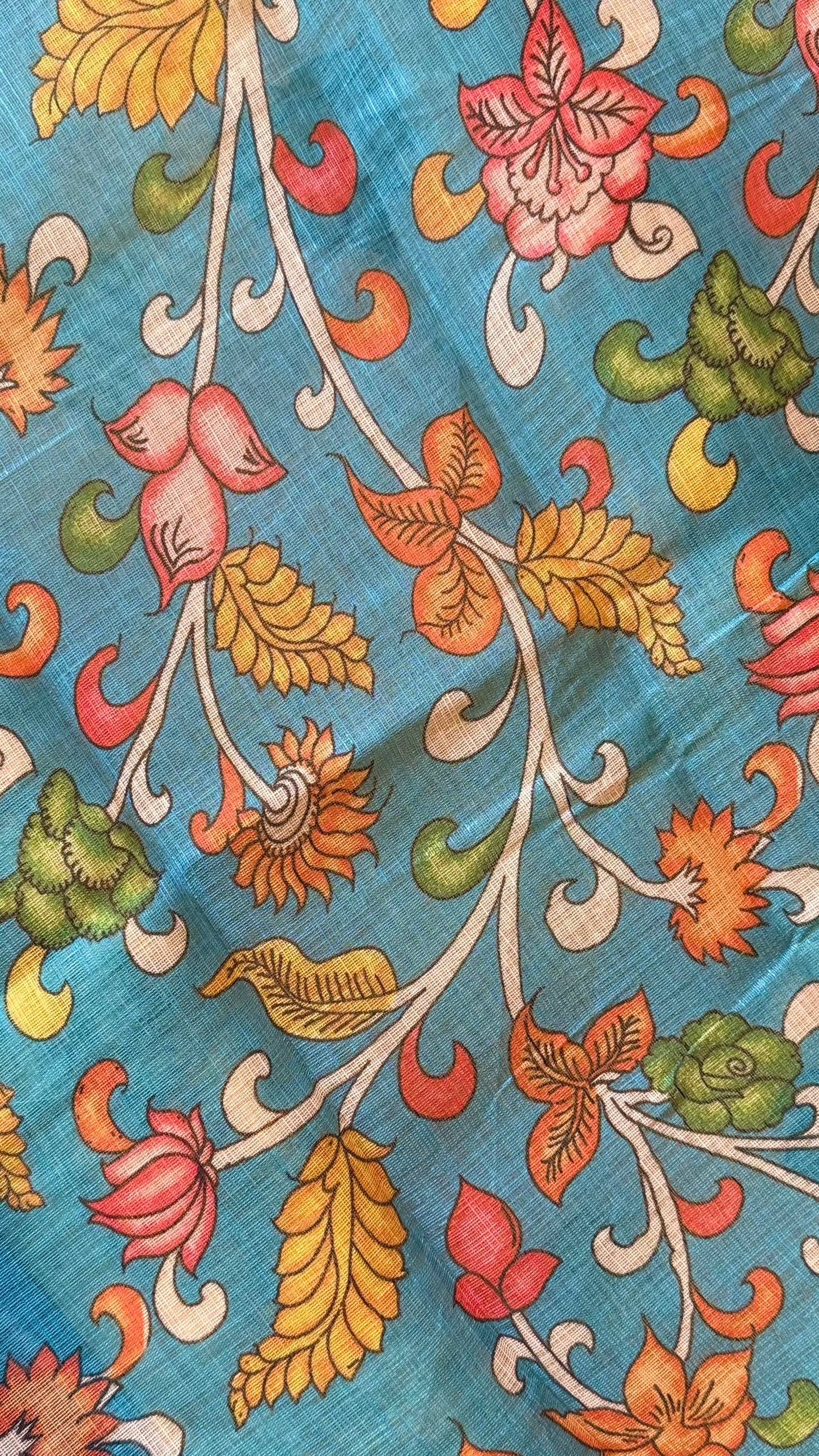 Sunayana – A Vibrant Yellow Saree with Blue Floral Border and Tassels