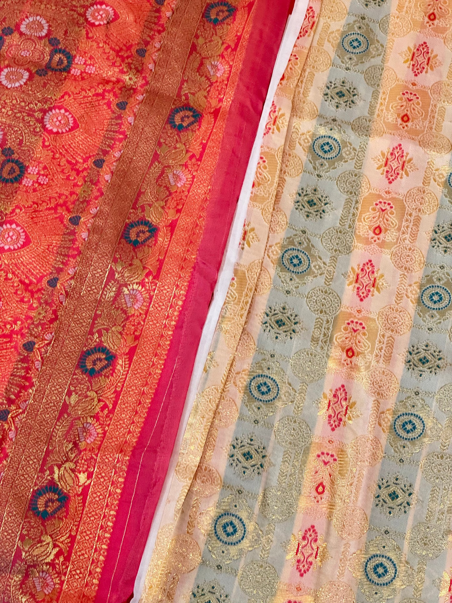 Aaradhya – A Handwoven Ivory Patola Saree with Scarlet Border and Intricate Golden Zari Work